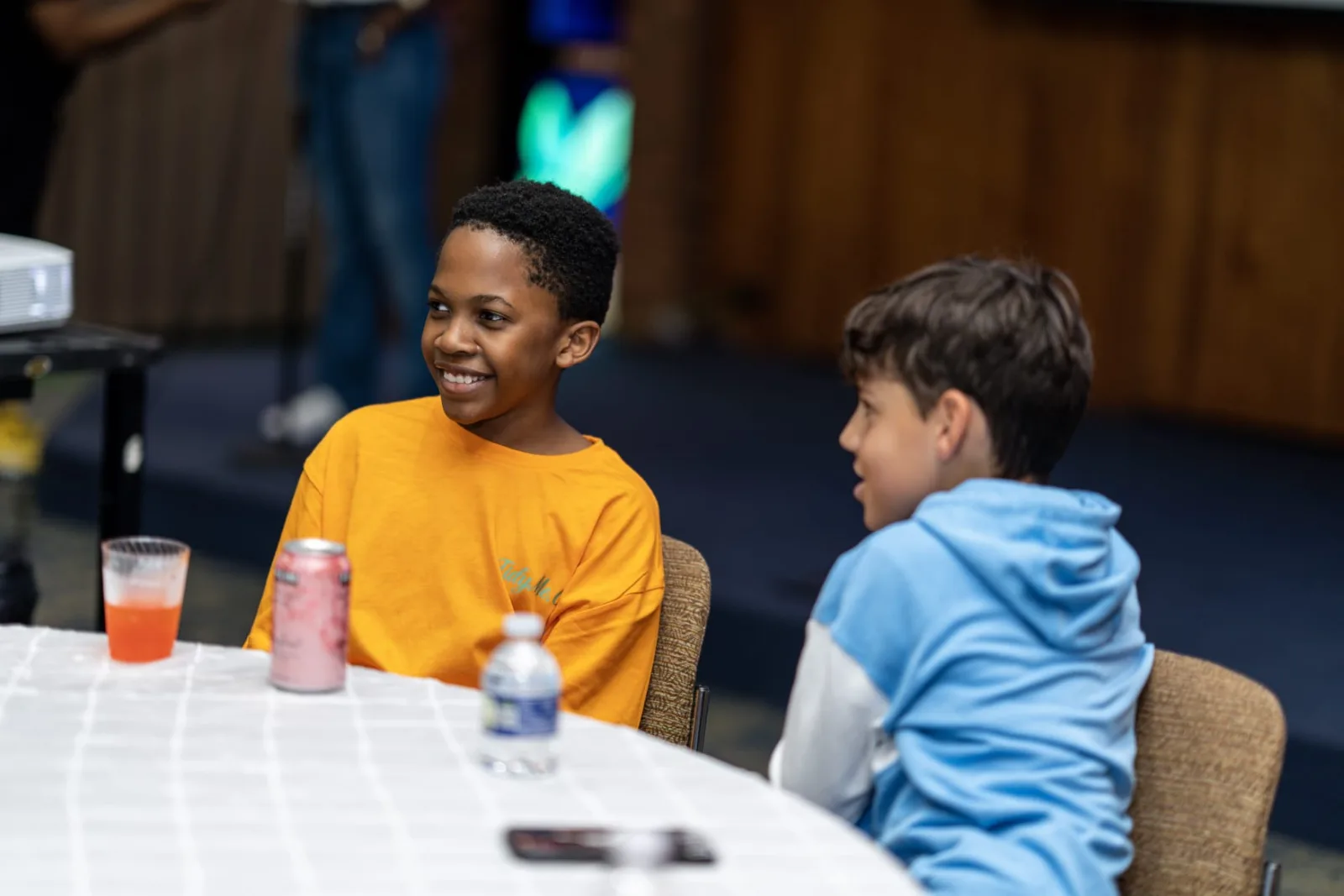 Two students talking during an R1YC community program