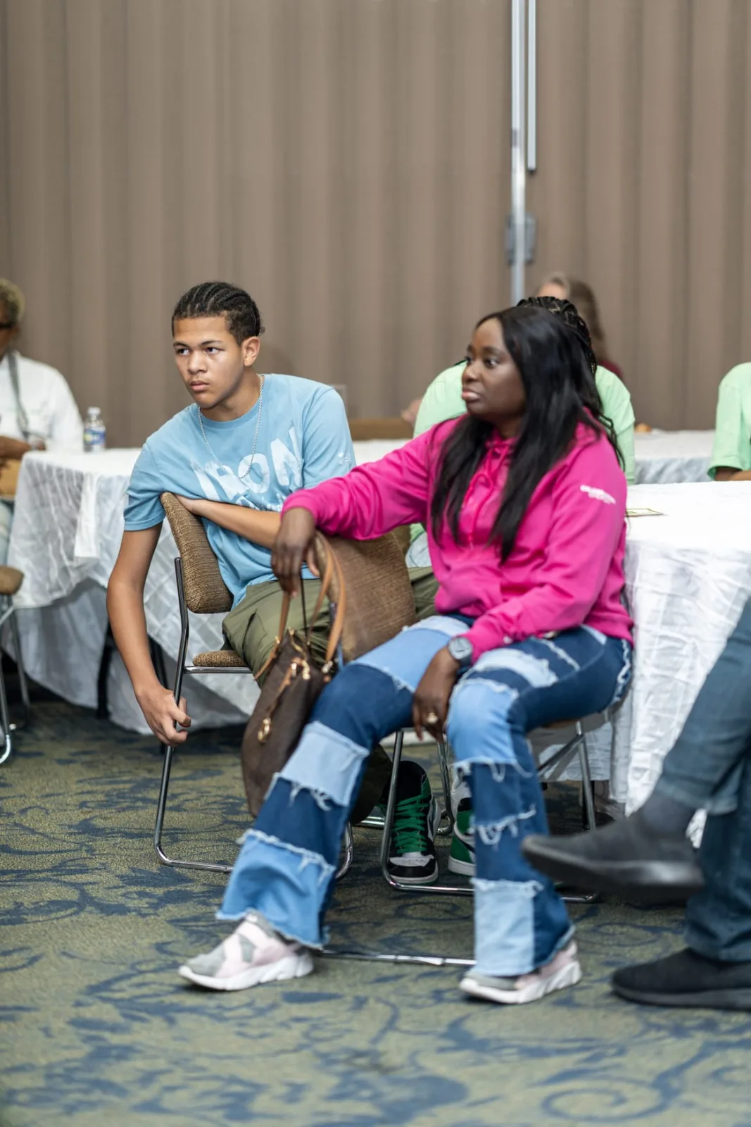 Students listening during a community learning session
