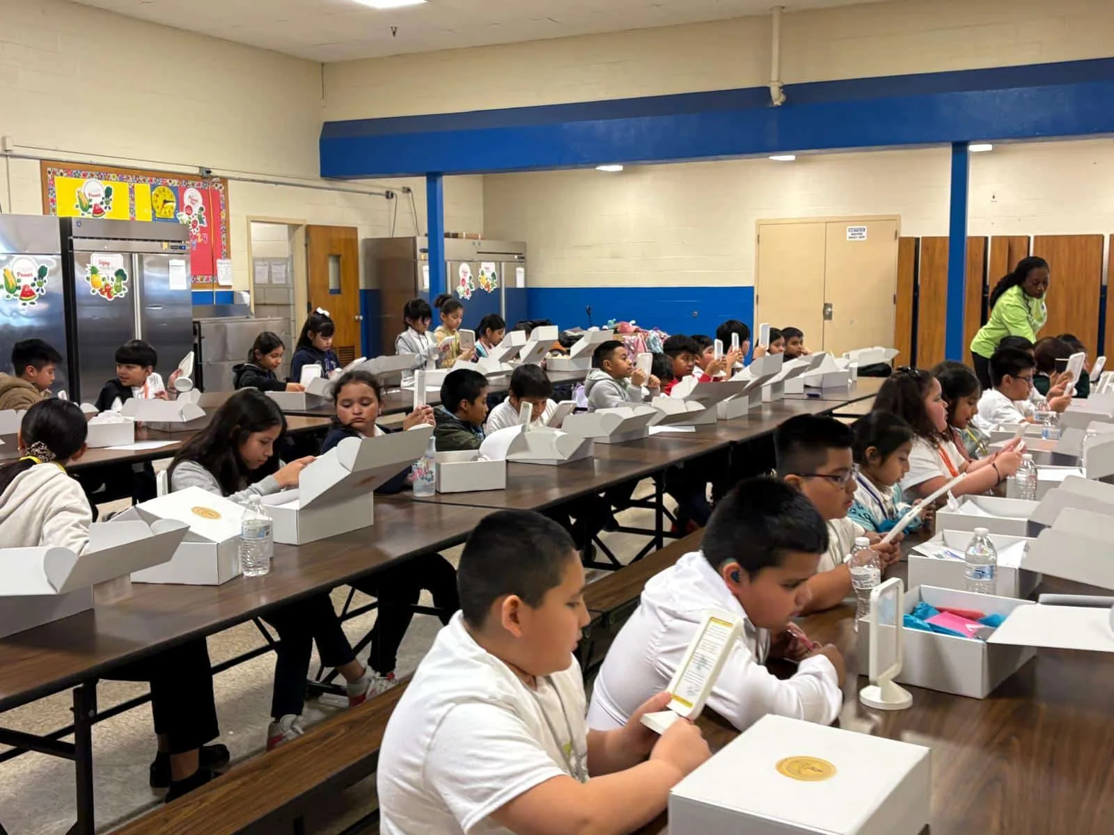 Students working independently at classroom activity tables